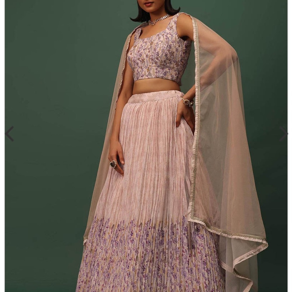 Beautiful peach lehenga with embroidery and floral bottom